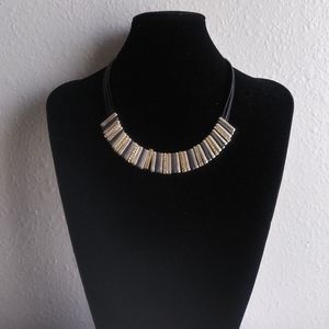 Tri-toned necklace on multi-strand rope